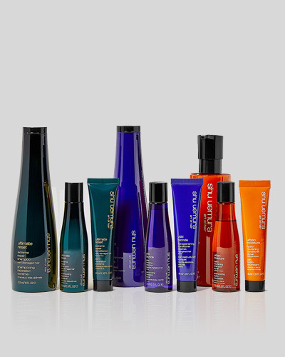 Stylist applying a keratin smoothing treatment for frizz-free, healthy hair